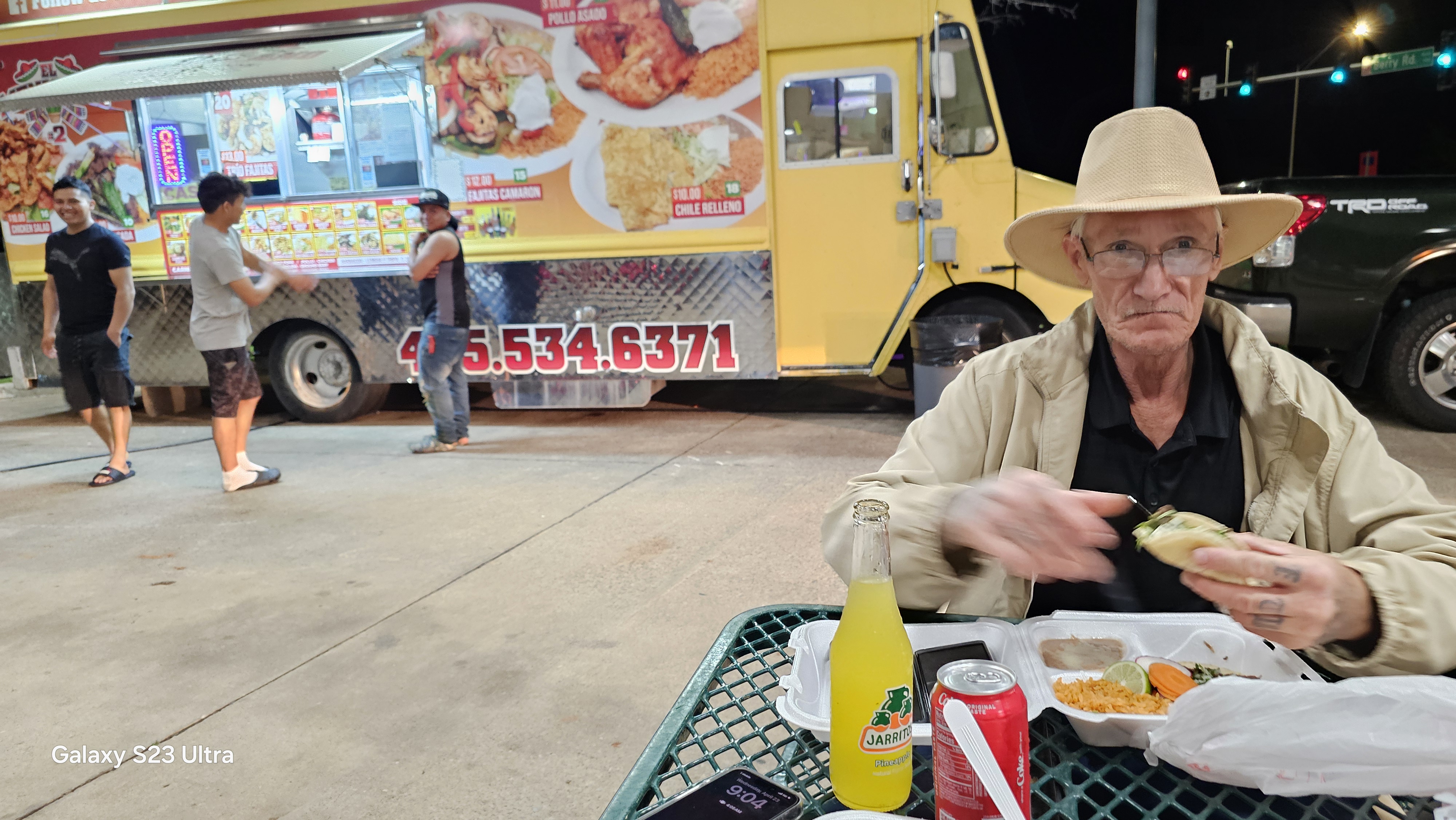 Lonnie eating tacos at a Norman food truck